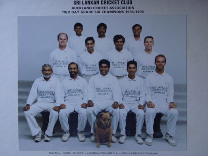 Black and white team photo: Auckland Cricket Association Two Day Grade Six Champions 1994-95, with the team dog in the front row